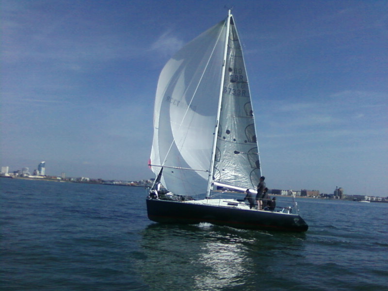 Black Diamond with spinnaker alongside